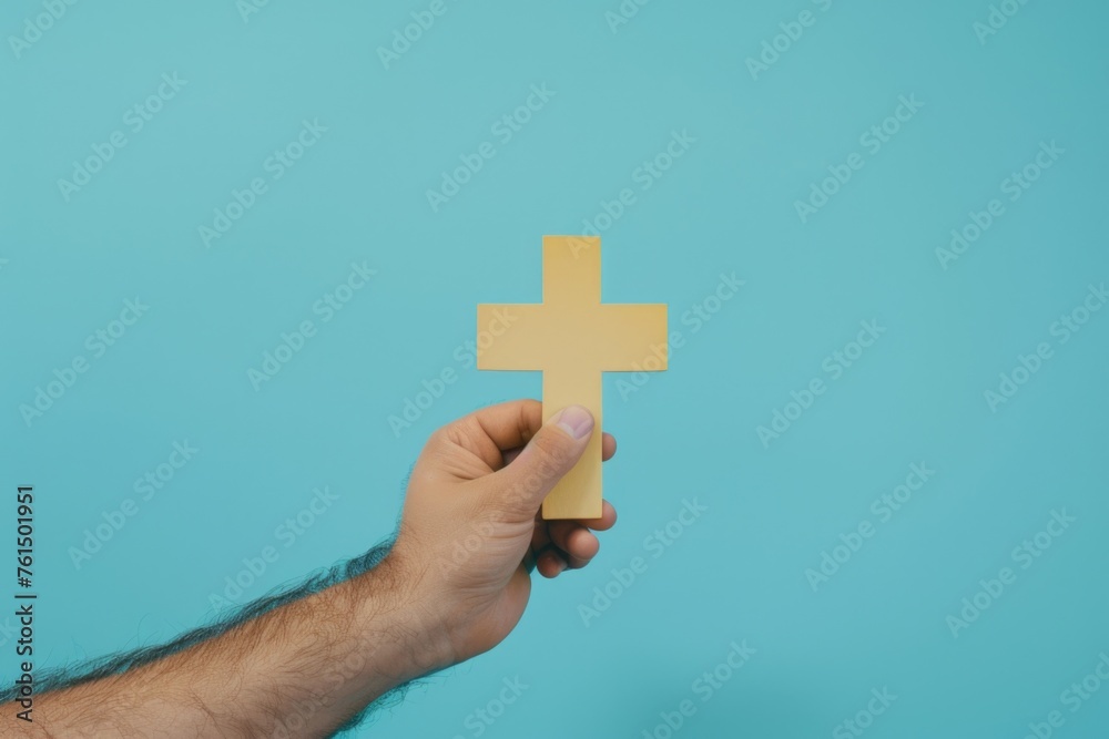 A person holding a piece of paper with a cross symbol, suitable for religious or medical concepts A person holding a piece of paper with a cross symbol, suitable for religious or medical concepts