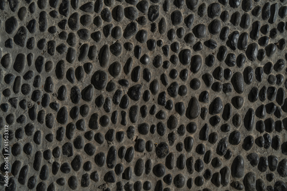 Background texture of a stone pavement with small holes, close-up portugal, madeira, Background texture of a stone pavement with small holes, close-up portugal, madeira,