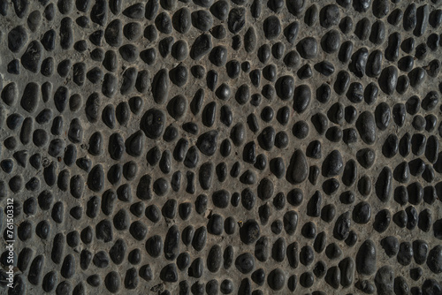 Background texture of a stone pavement with small holes, close-up portugal, madeira, 