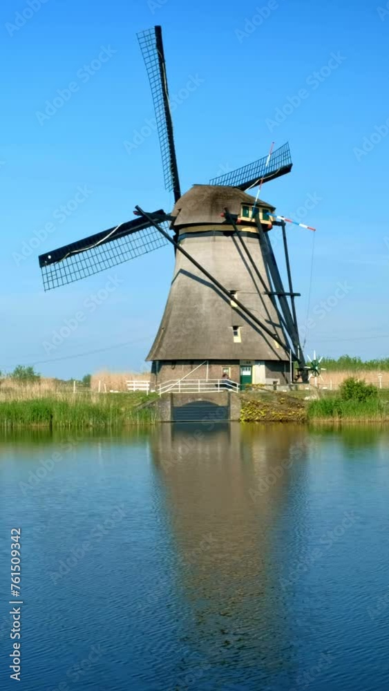 Netherlands rural village scenic view - windmills at famous tourist site Kinderdijk in Holland. Kinderdijk , Netherlands Netherlands rural village scenic view - windmills at famous tourist site Kinderdijk in Holland. Kinderdijk , Netherlands
