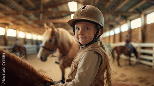 Young brown-haired girl practices riding a horse © chutikan