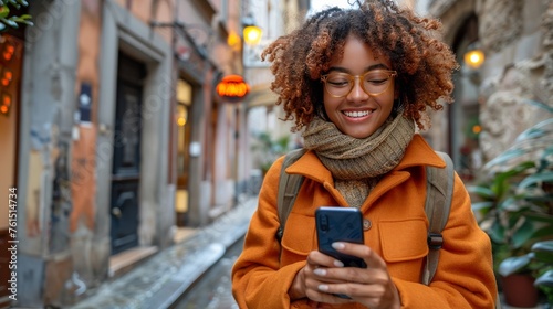 Woman in Yellow Jacket Looking at Cell Phone