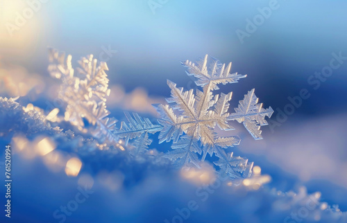 A close up of a snowflake on a snowy surface. Perfect for winter-themed designs © Fotograf