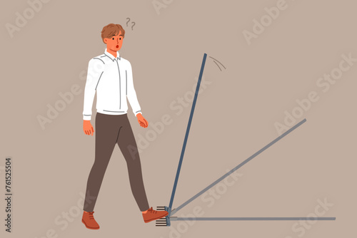 Business man steps on rake, risking injury, for concept of bankruptcy due to mistake. Stupid guy makes mistake, needing to improve intellectual and professional knowledge of problem solving
