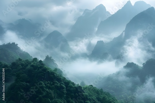 Majestic Mountains: A panoramic shot of majestic mountain peaks shrouded in mist, showcasing the grandeur of nature.   © Tachfine Art
