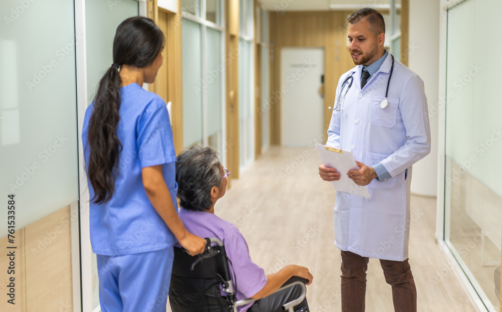 Fototapeta premium Man doctor with stethoscope service help support discussing and consulting care talk to sick senior asian woman patient in hospital,caregiver,elderly,recovery,illness insurance.healthcare and medicine