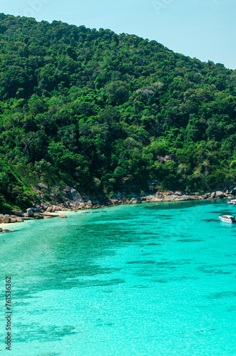 Tropical islands of ocean blue sea water and white sand beach at Similan Islands with famous Sail Rock, Phang Nga Thailand nature landscape