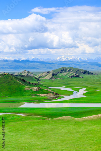 Curved river and green grassland natural landscape in Xinjiang photo