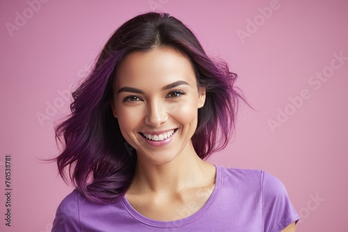 Charming, cute woman wearing a purple t-shirt, smiles, filling the frame, isolated on a pink background, natural light, high-key exposure, photography terms like bokeh effect, soft focus, pastel tones © ramses