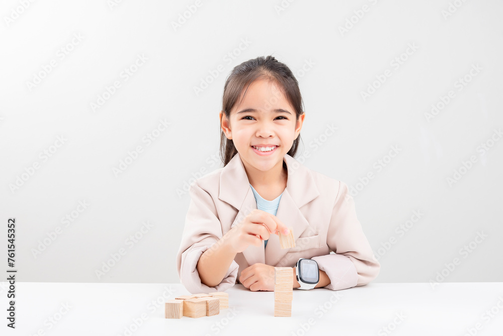 little business girlplacing wooden blocks