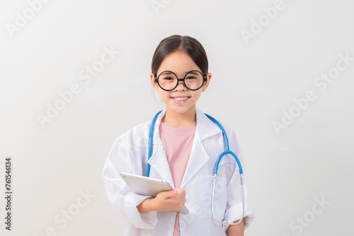 Cute little girl asian with stethoscope playing doctor