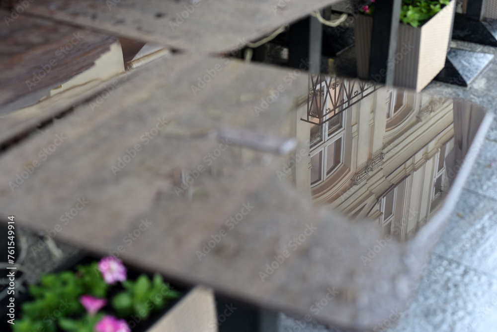 A street with restaurants. Wet tables and chairs. After the rain A street with restaurants. Wet tables and chairs. After the rain