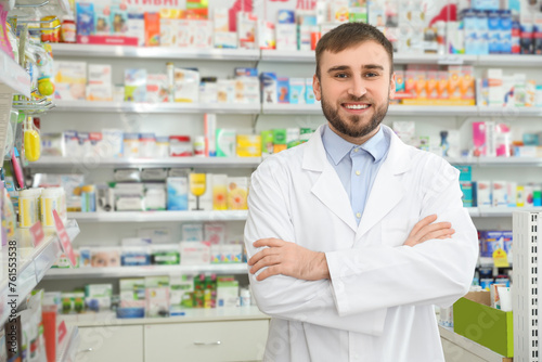 Portrait of professional pharmacist in modern drugstore. Space for text