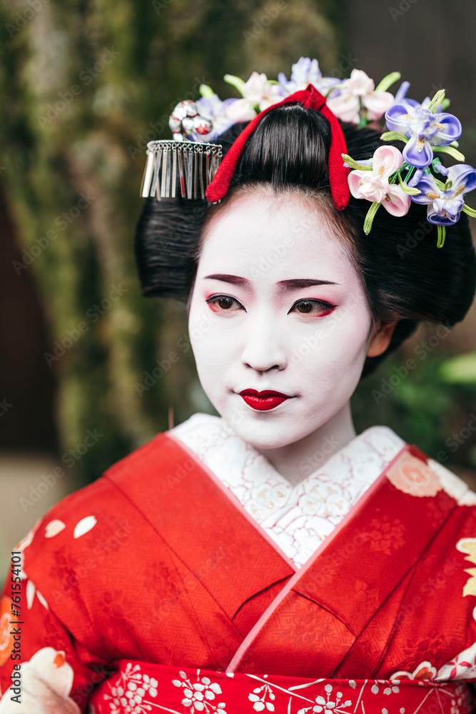 A geisha's striking makeup and ornate hairpins are set against a backdrop of lush greenery, a harmony of nature and traditional Japanese aesthetics A geisha's striking makeup and ornate hairpins are set against a backdrop of lush greenery, a harmony of nature and traditional Japanese aesthetics