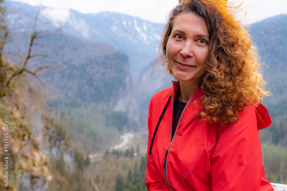 Portrait of beautiful young woman wearing red jacket outdoors Portrait of beautiful young woman wearing red jacket outdoors