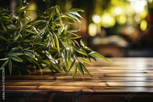 empty wooden table blurred bamboo tree background with sun beams,