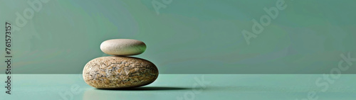 Minimalist zen concept with round stone on smooth green backdrop, simplicity and balance in design