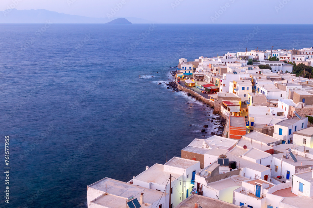 Panoramic view during blue hour of Mandraki village, a beautiful, traditional village, capital of Nisyros island, in Dodecanese islands, Greece.