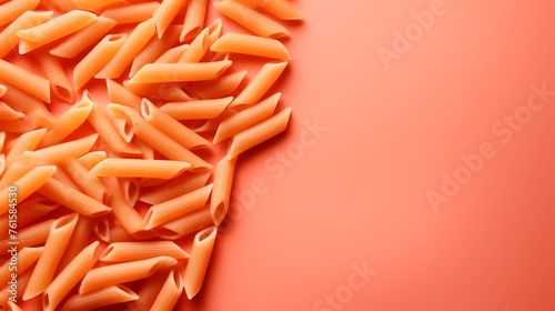 Orange pasta on minimalist background with copy space, italian cuisine concept for food lovers