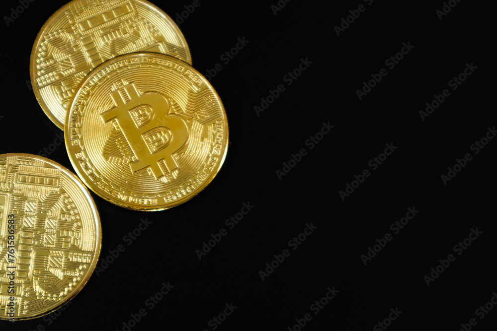 Golden bitcoin on black background. Business, money, cryptocurrency concept. Golden bitcoin on black background. Business, money, cryptocurrency concept.