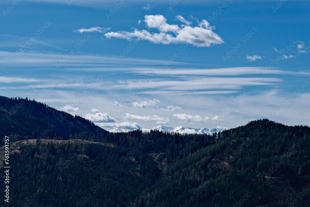 clouds over the snow covered mountains clouds over the snow covered mountains