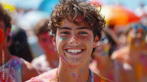 A festive mood prevails as young individuals cheer and celebrate outside a summer festival, their joyful expressions and colorful splashes evoking the spirit of the Holi festival. © tong2530