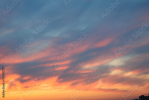 Obraz na płótnie Stunningly beautiful multi-colored violet-pink-lilac evening sky with the yellow light of the setting sun, multi-colored clouds spreading from the lower horizon w salonie