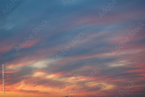Obraz na płótnie Stunningly beautiful multi-colored violet-pink-lilac evening sky with the yellow light of the setting sun, multi-colored clouds spreading from the lower horizon w salonie