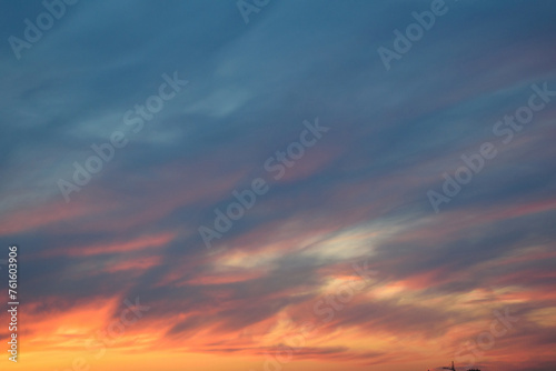 Obraz na płótnie Stunningly beautiful multi-colored violet-pink-lilac evening sky with the yellow light of the setting sun, multi-colored clouds spreading from the lower horizon w salonie
