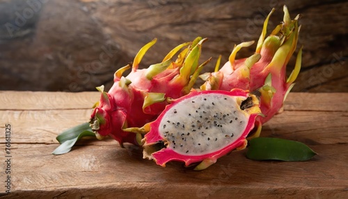 Pitayas or Dragon fruits over wooden table. high quality photo photo