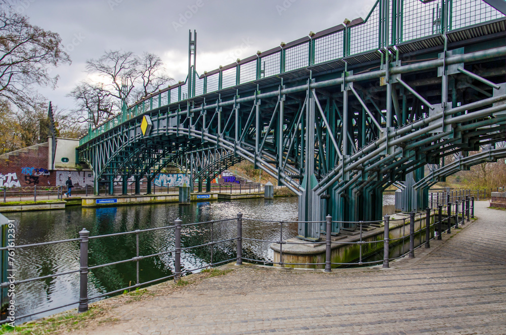 Berlin, Germany, March 6, 2024: steel bridge across a canal in Tiergarten park Berlin, Germany, March 6, 2024: steel bridge across a canal in Tiergarten park