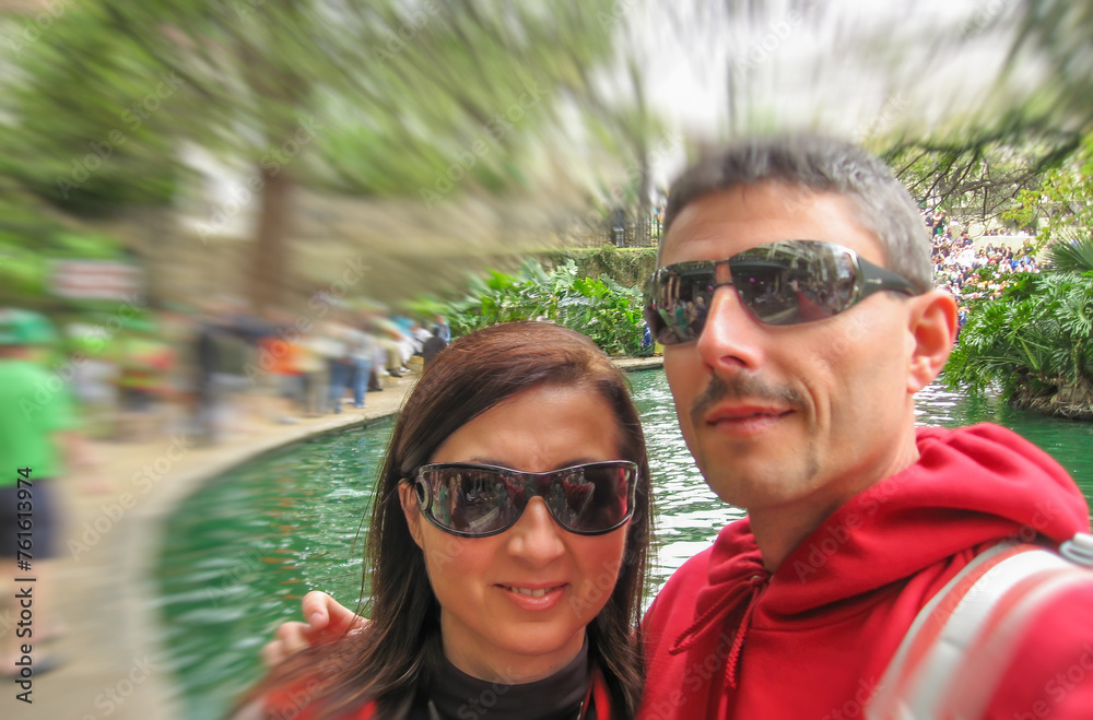 San Antonio, Texas. Happy couple of tourists along the city river San Antonio, Texas. Happy couple of tourists along the city river