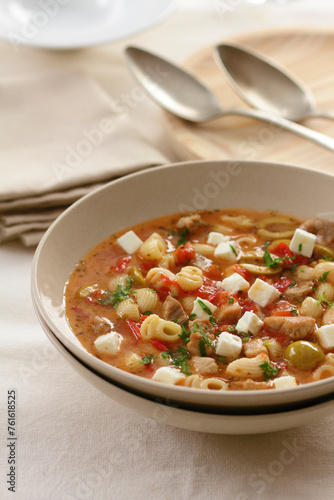 Pasta soup with meat and feta cheese. Greek food