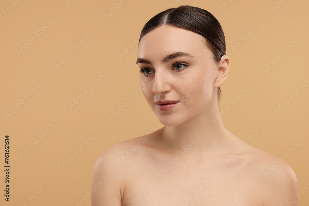 Portrait of beautiful woman on beige background. Space for text Portrait of beautiful woman on beige background. Space for text