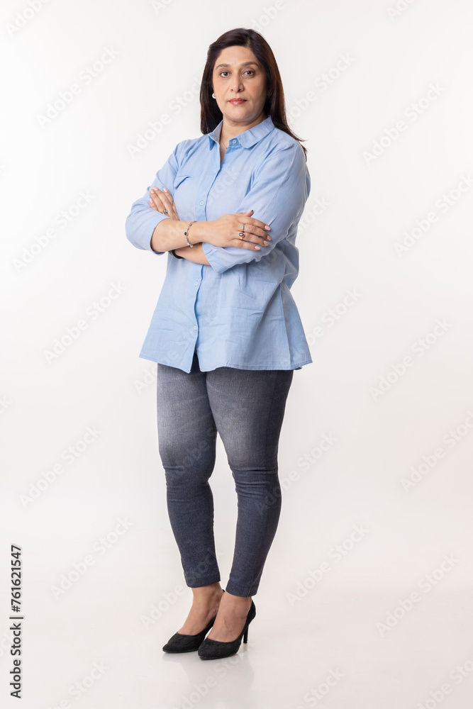 Portrait of smiling businesswoman with arms crossed on white background Portrait of smiling businesswoman with arms crossed on white background