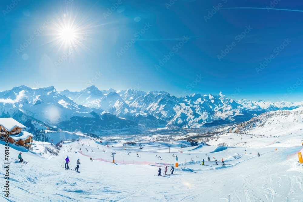 A ski slope with many skiers and snowboarders on it