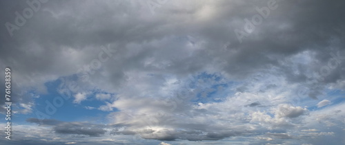 Russia. South of Western Siberia. Panorama of the daytime summer sky with cumulus clouds over the fields of Kuznetsk Alatau.