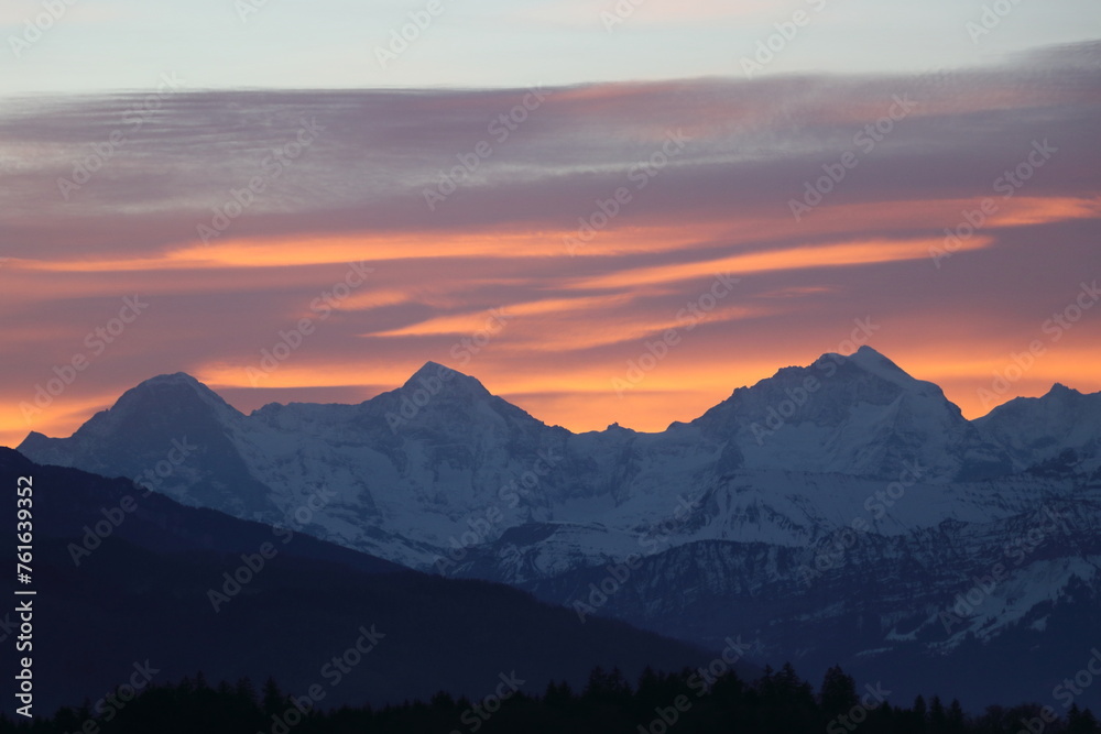 Orange sunset over Eiger Monch and Jungfrau