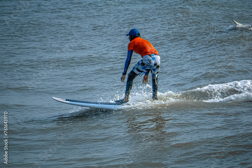 Canvas Print Extreme Fast Action Sports or Highspeed Action Photography or High Shutterspeed Photography - Picture of Surfer Man Surfing On Blue Ocean Wave, Kovalam Beach, Chennai, Tamilnadu, South India