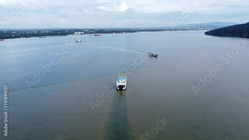 Aerial view of a ferry sailing on the sea to transport passengers photo