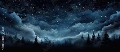 A midnight sky with cumulus clouds and twinkling stars over a forest creates a serene natural landscape. The horizon is illuminated by the moonlight, with a gentle wind rustling through the trees photo