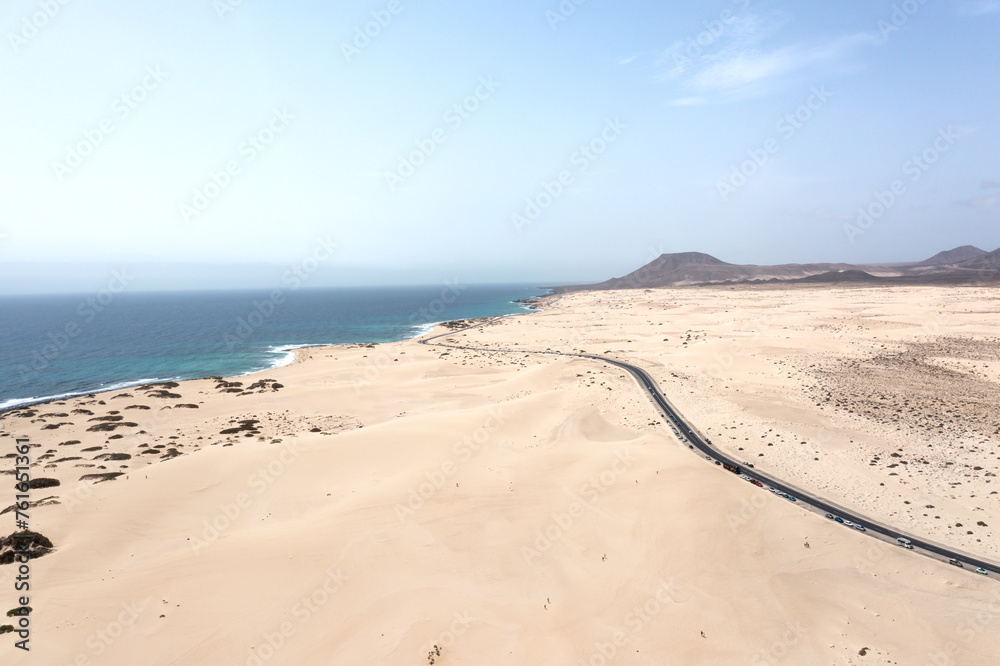 Panoramic high angle aerial drone view of Corralejo National Park (Parque Natural de Corralejo) with sand dunes located in the northeast corner of the island of Fuerteventura, Canary Islands, Spain Panoramic high angle aerial drone view of Corralejo National Park (Parque Natural de Corralejo) with sand dunes located in the northeast corner of the island of Fuerteventura, Canary Islands, Spain
