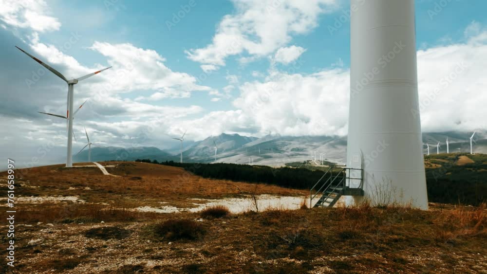 Wind farm or wind park at sunset located in the mountains of Italy Europe to realize clean energy. It’s sustainable, renewable energy for enviromental. Iconic location for landscape photographers blog