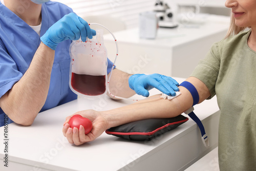 Patient undergoing blood transfusion in hospital, closeup photo