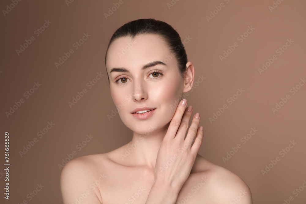 Portrait of beautiful young woman on brown background Portrait of beautiful young woman on brown background
