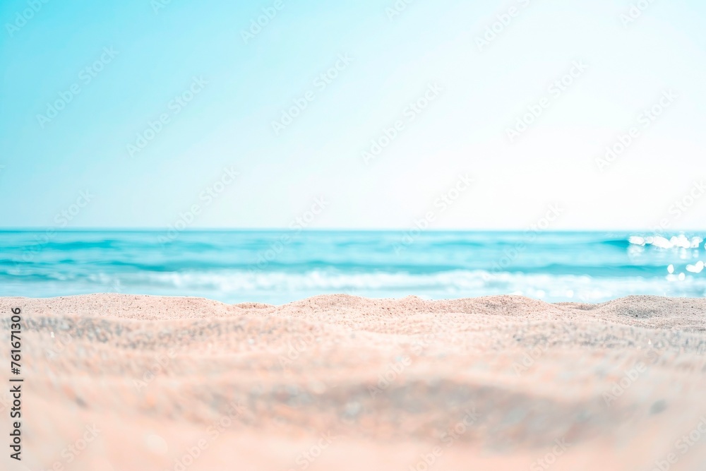 Beautiful summer background with a sandy beach and blue sea water, close up and blurred, copy space concept. Summer vacation banner template design for travel or decoration background Beautiful summer background with a sandy beach and blue sea water, close up and blurred, copy space concept. Summer vacation banner template design for travel or decoration background