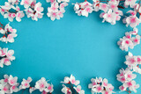 White jasmine flowers on the blue background. Summer or spring background. Copy space.
