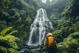 A person wearing a backpack stands in front of a majestic waterfall, taking in the view, A backpacker pausing to appreciate a stunning waterfall located in dense forest, AI Generated
