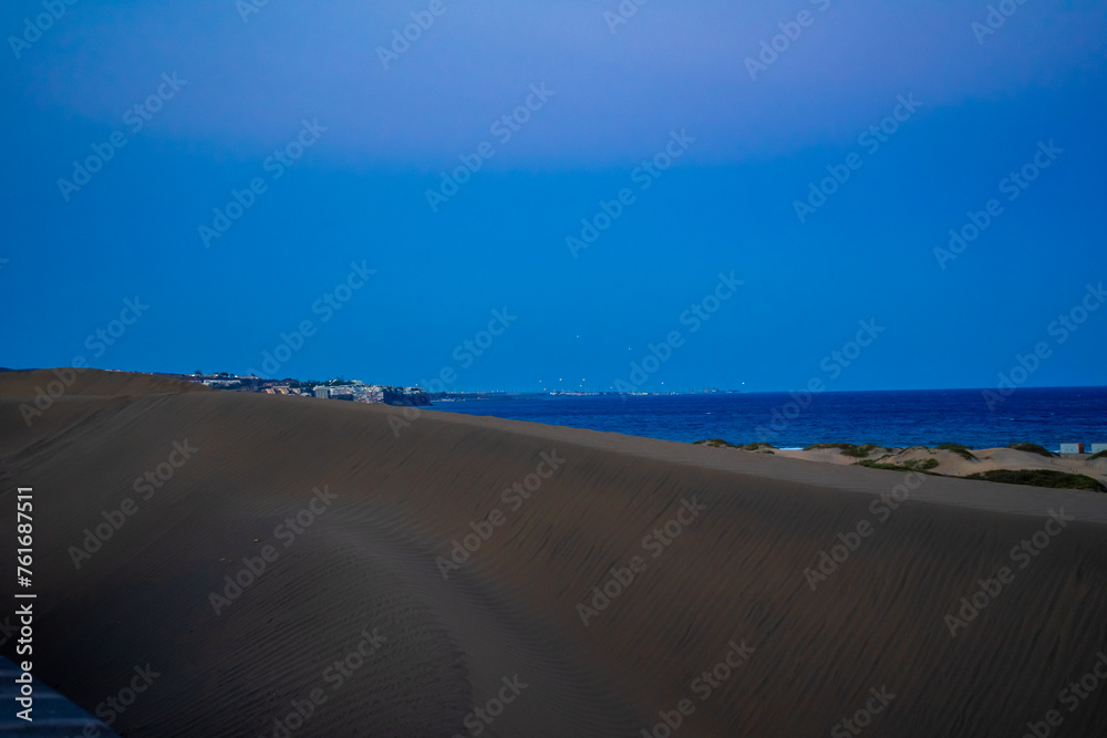 Sunset, Moon and Evening Sky over Maspalomas on Gran Canary Island Spain. Sunset, Moon and Evening Sky over Maspalomas on Gran Canary Island Spain.