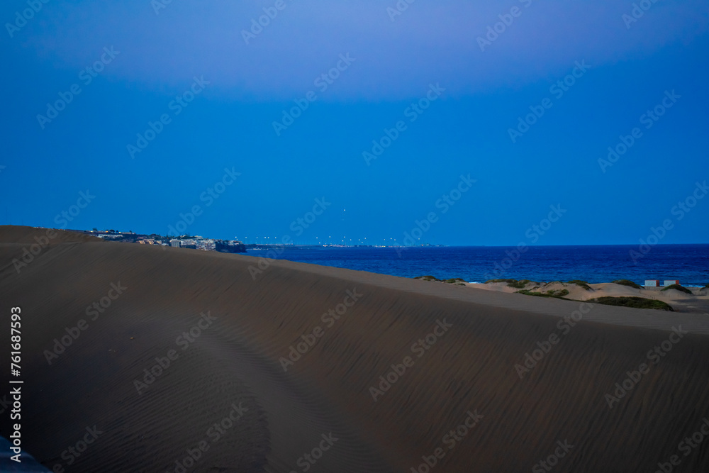 Sunset, Moon and Evening Sky over Maspalomas on Gran Canary Island Spain. Sunset, Moon and Evening Sky over Maspalomas on Gran Canary Island Spain.
